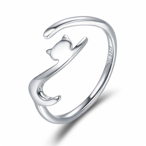 Close up of sterling silver ring. Ring is adjustable with cat shape on one end. Looks like a cat with a long tail. Width is 0.2 cm and made with 925 sterling silver, plated platinum, and a polished finish